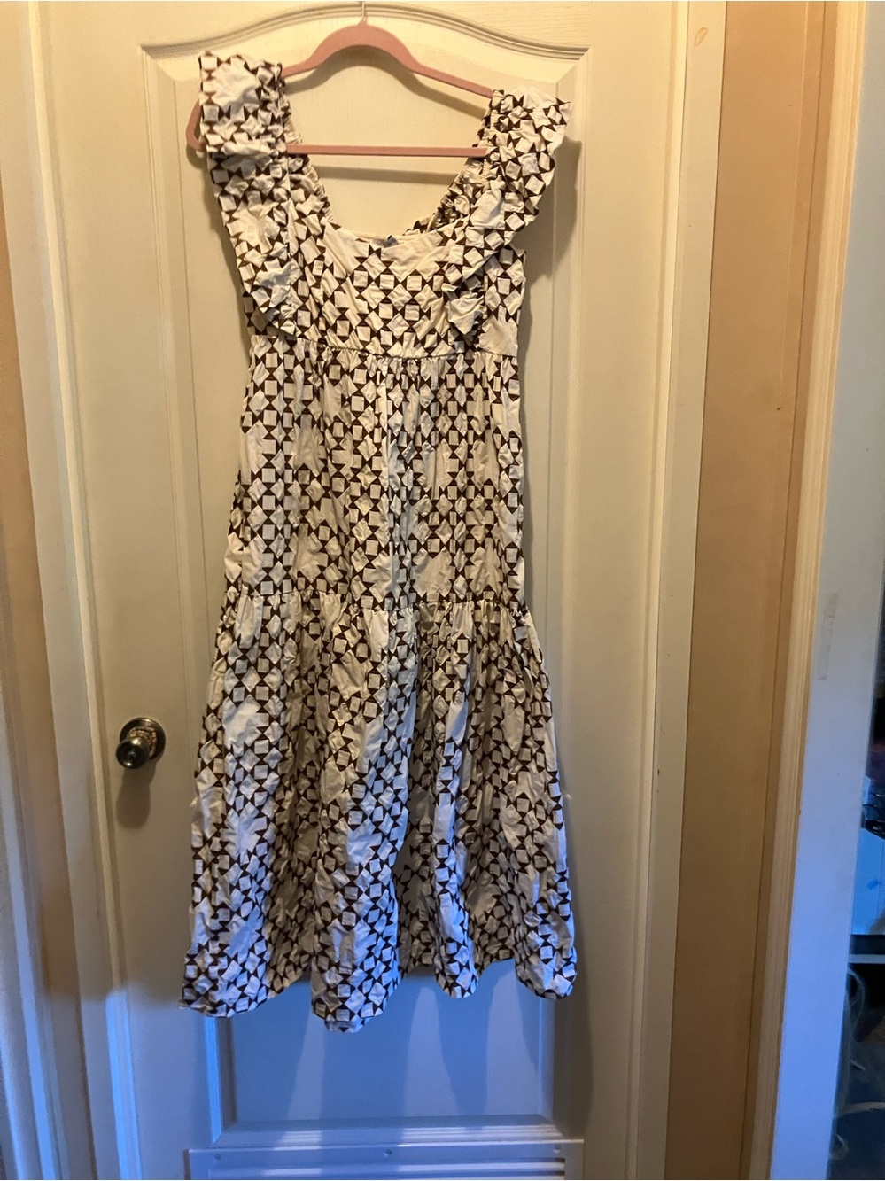 Sleeveless White Maxi Dress with Brown Geometric Print and Ruffle Shoulders